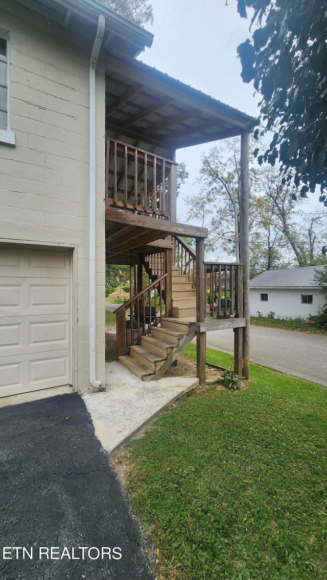 view of home's exterior featuring a yard and a garage