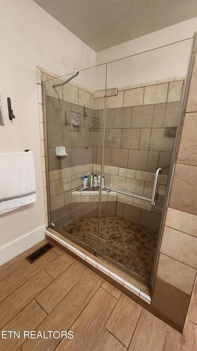 bathroom with an enclosed shower