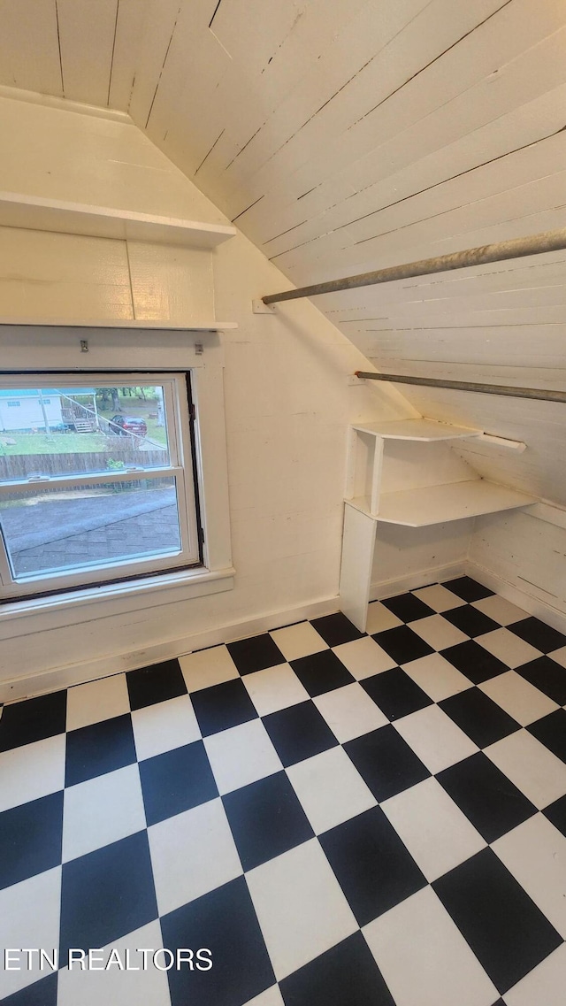 additional living space featuring lofted ceiling