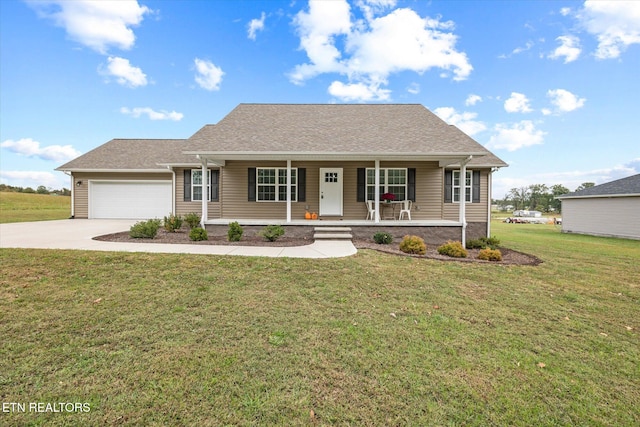 view of front of property with a front yard, covered porch, and a garage