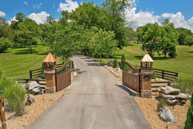 view of property's community with a yard