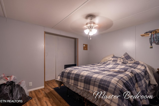 bedroom featuring a closet, ceiling fan, and hardwood / wood-style flooring