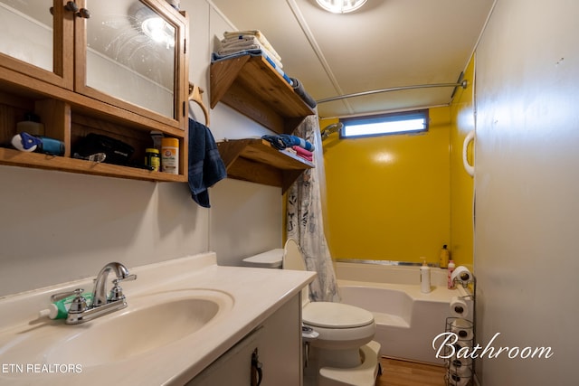 full bathroom featuring vanity, shower / tub combo with curtain, toilet, and hardwood / wood-style flooring