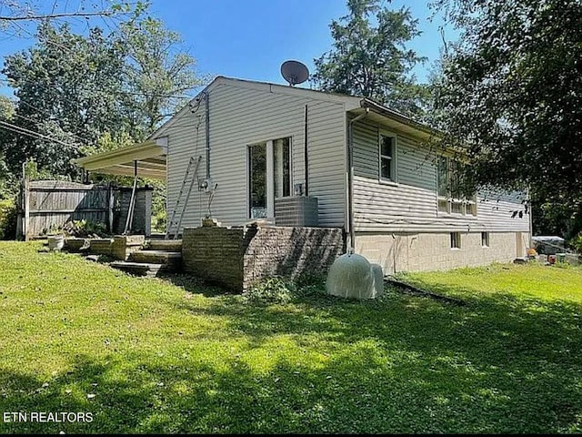 view of property exterior with a lawn