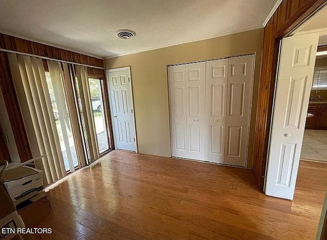 foyer with light hardwood / wood-style flooring and a textured ceiling