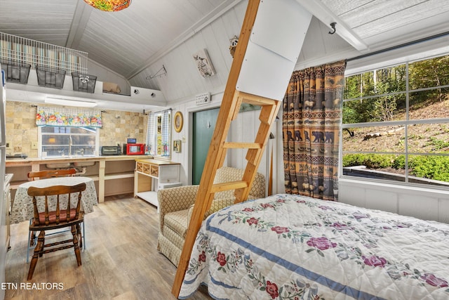 bedroom with lofted ceiling, wood ceiling, and light wood-type flooring