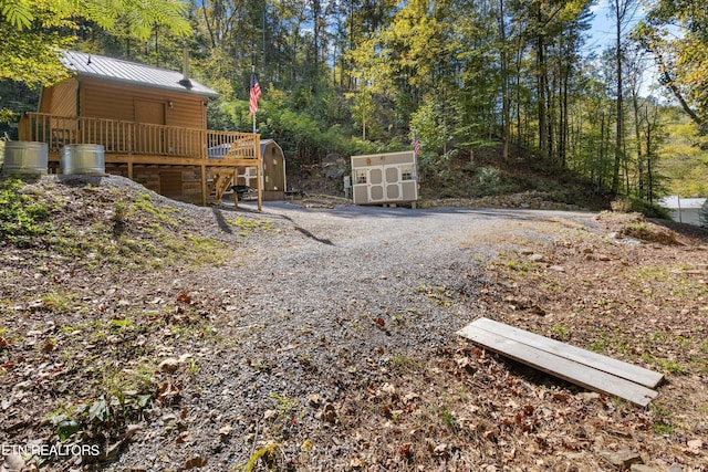 view of yard featuring a wooden deck