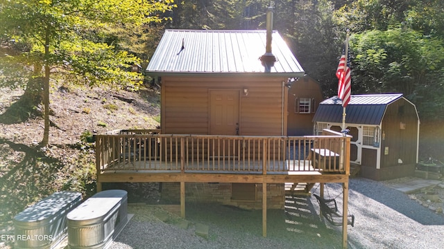 deck featuring a shed and a patio area