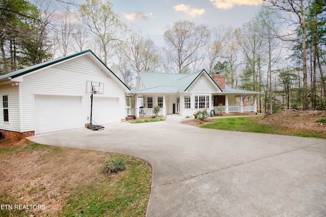 view of front of house with a garage and a porch