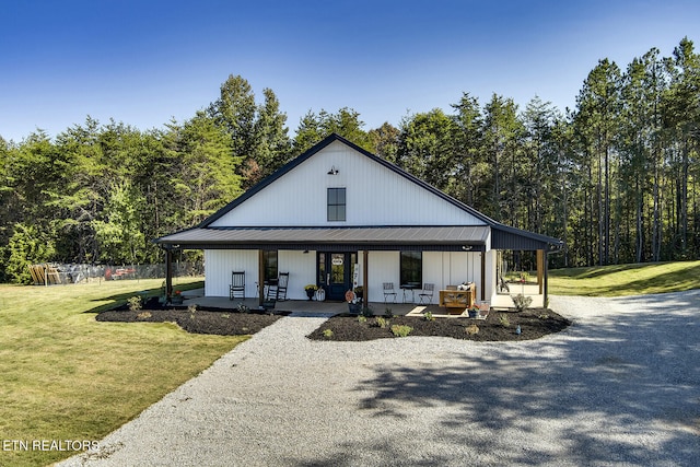 modern farmhouse with a porch and a front yard