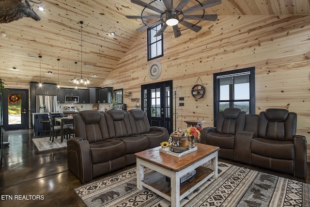 living room featuring high vaulted ceiling, wooden walls, a healthy amount of sunlight, and wood ceiling