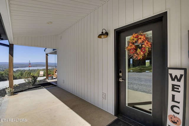 view of exterior entry featuring a water view