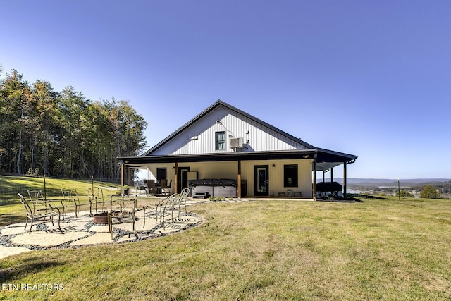 back of property featuring a patio and a yard