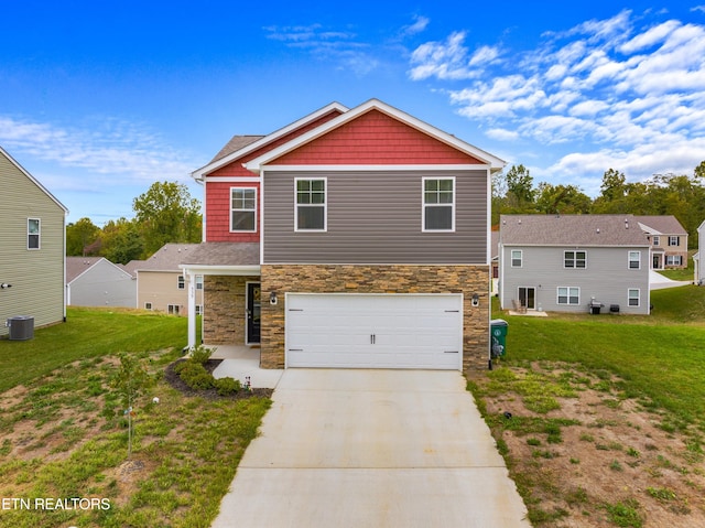 view of front of house with a front yard, a garage, and central AC unit