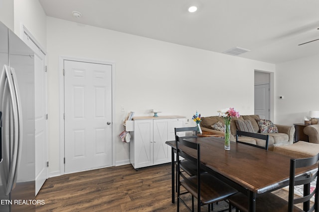 dining area with dark hardwood / wood-style floors