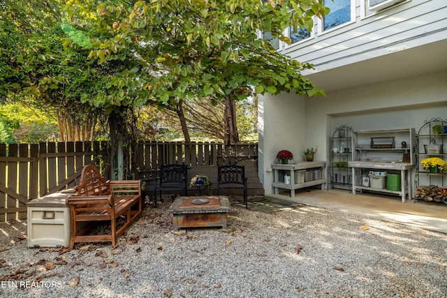 view of patio with a fire pit