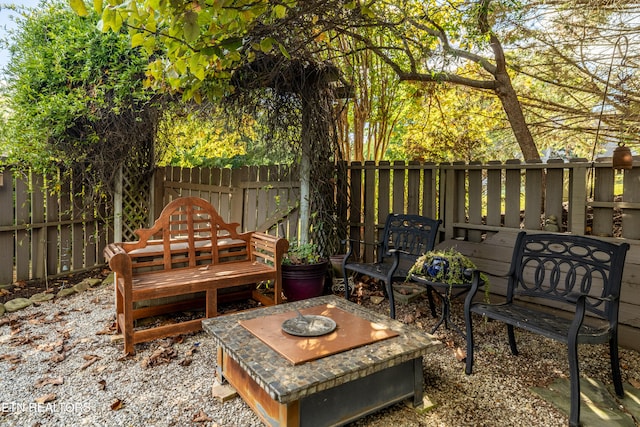 view of patio / terrace with an outdoor fire pit