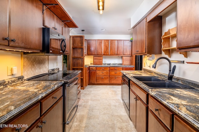 kitchen featuring sink, appliances with stainless steel finishes, and decorative backsplash