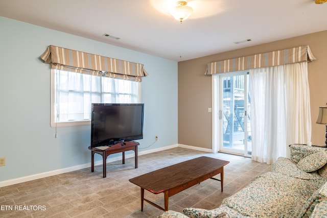 living room with a healthy amount of sunlight