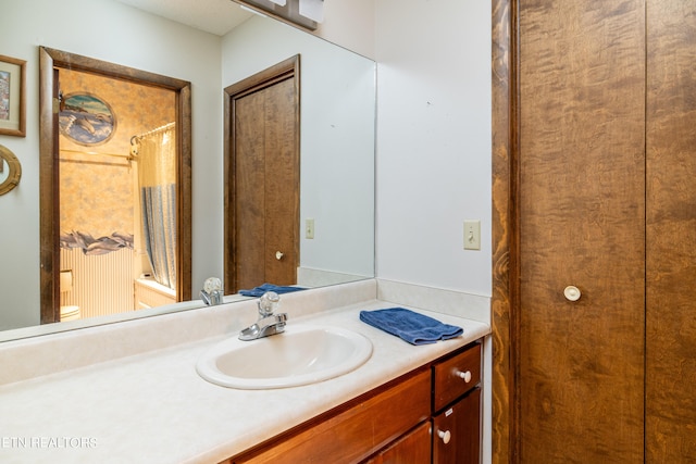 full bathroom with vanity, toilet, and shower / tub combo