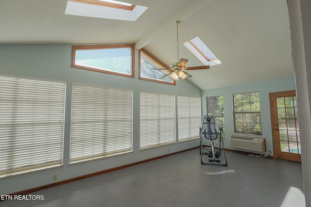 exercise area with high vaulted ceiling, a wall mounted AC, a skylight, and ceiling fan