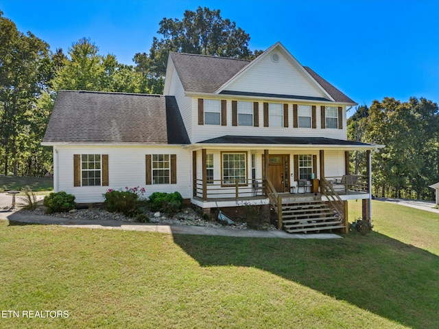 view of front of home with a porch and a front lawn