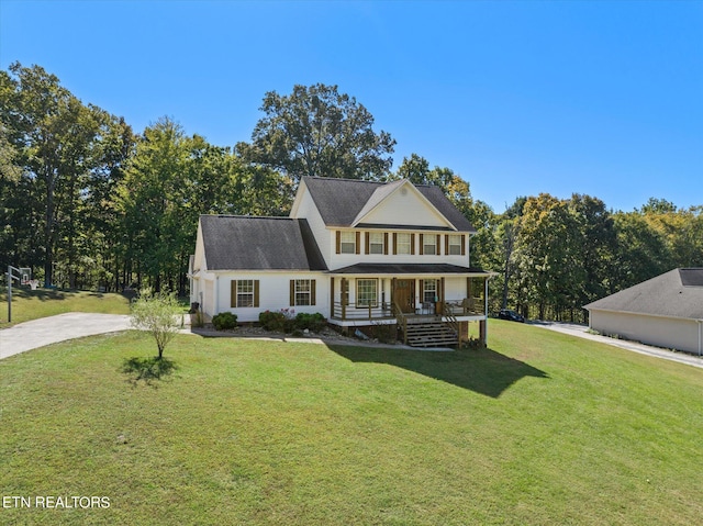 view of front facade with a front yard and a porch