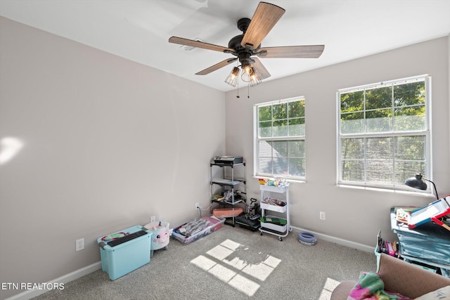 recreation room featuring ceiling fan and carpet floors