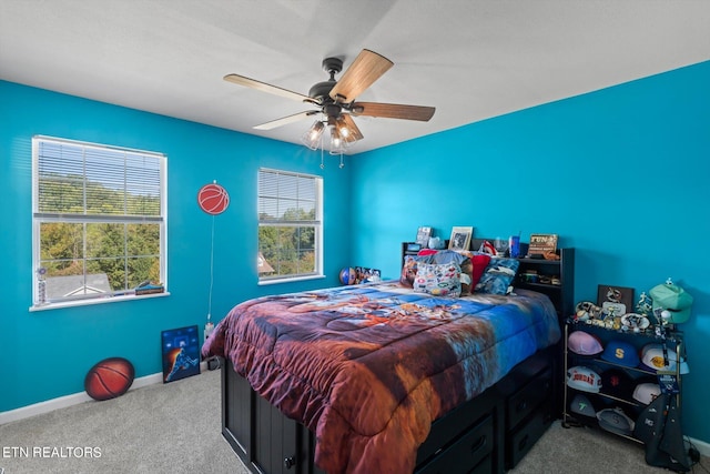 bedroom with ceiling fan and carpet