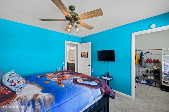 carpeted bedroom with a closet and ceiling fan