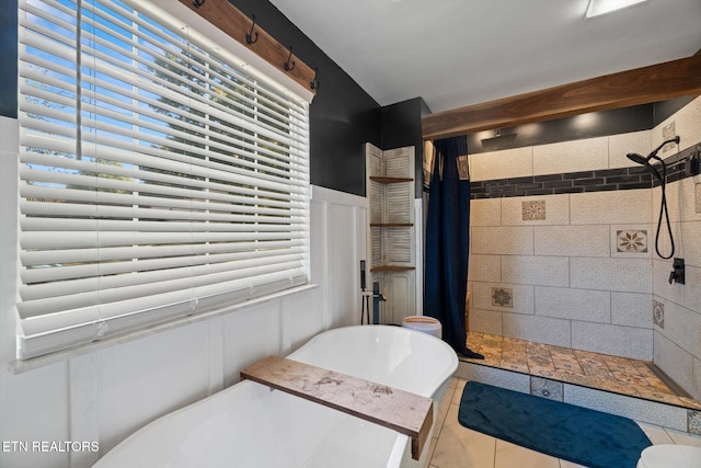 bathroom with tile patterned floors and curtained shower