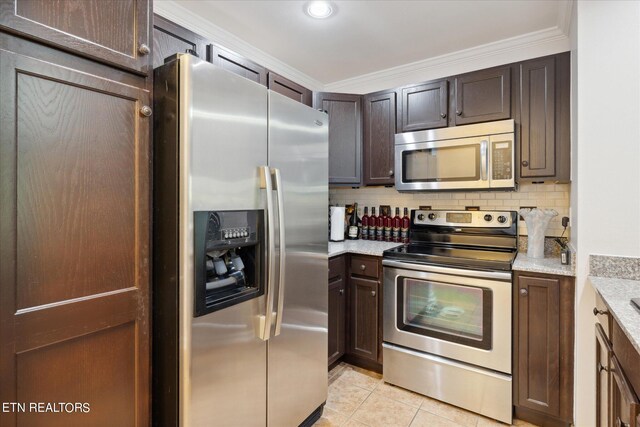 kitchen with tasteful backsplash, appliances with stainless steel finishes, light tile patterned flooring, dark brown cabinetry, and crown molding