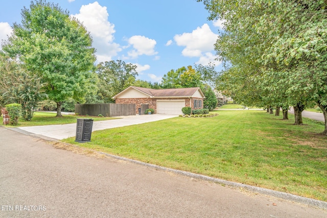 view of front of home featuring a garage and a front lawn