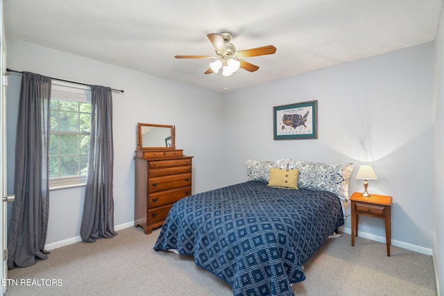 carpeted bedroom with ceiling fan