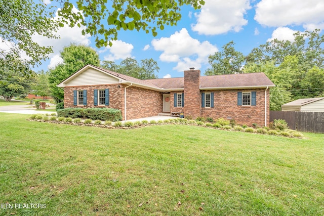 ranch-style house with a front lawn