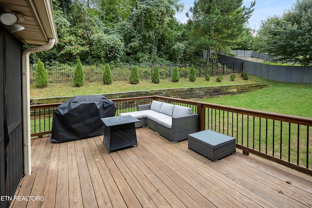 wooden deck with an outdoor living space, a lawn, and a grill