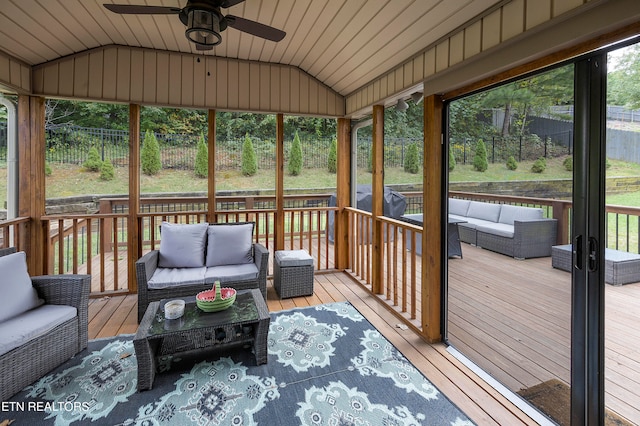 sunroom / solarium featuring lofted ceiling, ceiling fan, and wooden ceiling