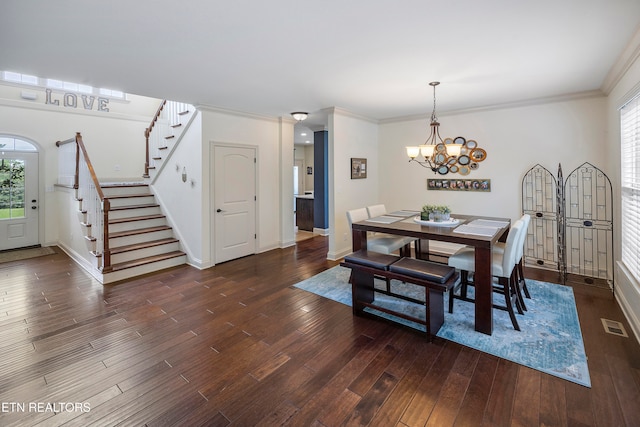 dining area with crown molding, a healthy amount of sunlight, and dark hardwood / wood-style flooring