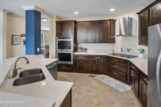 kitchen featuring light stone countertops, sink, stainless steel appliances, wall chimney exhaust hood, and ornamental molding