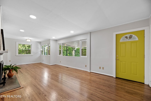 unfurnished living room featuring hardwood / wood-style floors