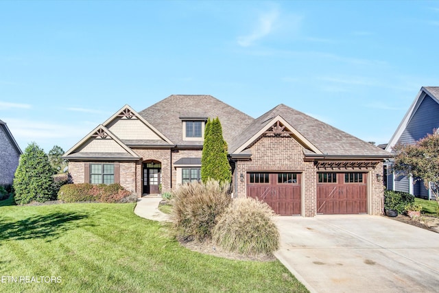 craftsman house with a garage and a front lawn