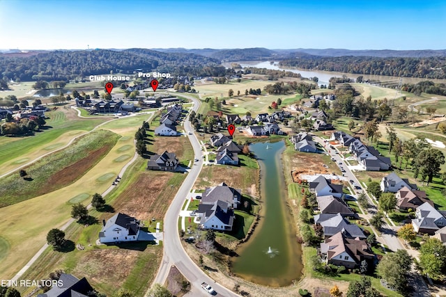 drone / aerial view with a water and mountain view