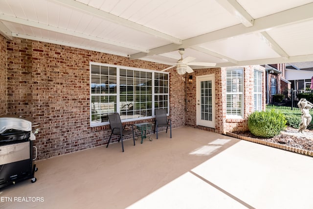 view of patio with a grill and ceiling fan