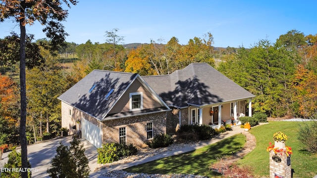 view of front of house featuring a front yard and a garage