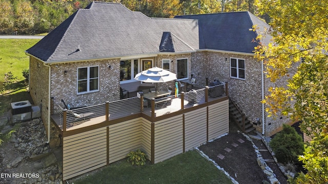 339 Eagles Rdg, Tazewell, TN 37879 - rear view of house featuring brick siding, a deck, cooling unit, and a shingled roof