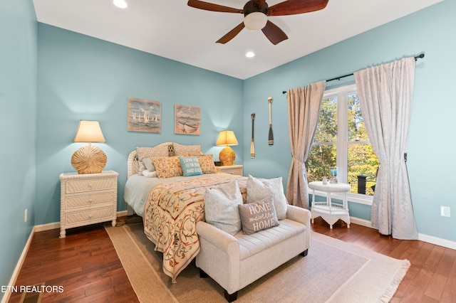 bedroom featuring dark wood-type flooring and ceiling fan