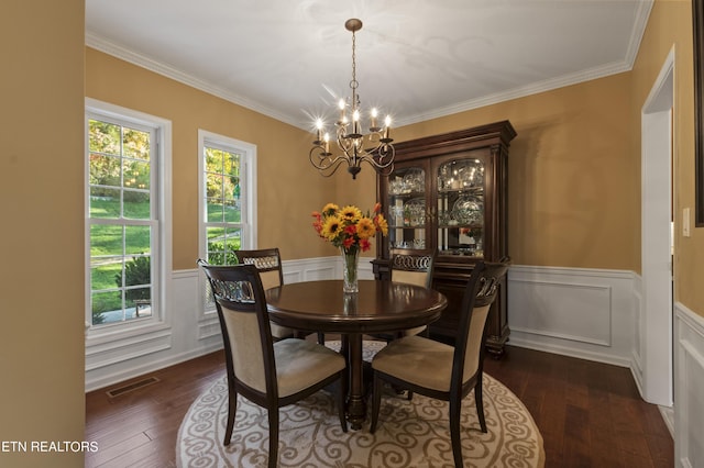 339 Eagles Rdg, Tazewell, TN 37879 - dining area with a chandelier, dark wood finished floors, a wainscoted wall, ornamental molding, and a decorative wall