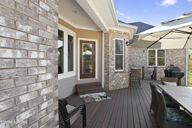 339 Eagles Rdg, Tazewell, TN 37879 - wooden deck with outdoor dining area, entry steps, and area for grilling