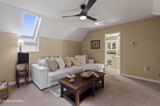 339 Eagles Rdg, Tazewell, TN 37879 - living room with ceiling fan, light carpet, vaulted ceiling, a skylight, and baseboards