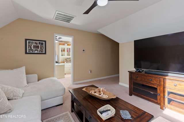 living room with ceiling fan, light carpet, and lofted ceiling